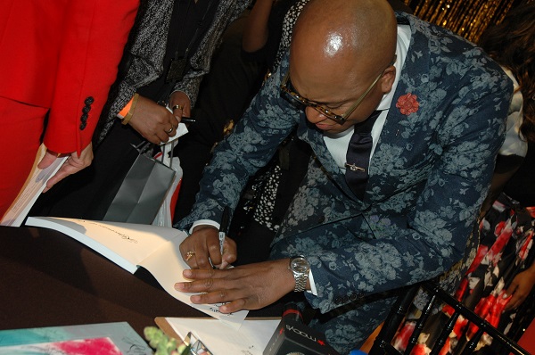 Doctor signing his book